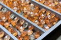 rows of finished diamonds in a storage tray