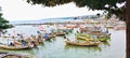 Rows of fishing boats parked on the beach in the early morning