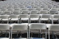 Rows of folding white chairs Royalty Free Stock Photo