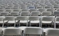 Rows of folding white chairs Royalty Free Stock Photo