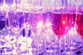 Rows of full champagne, sparkling wine and red wine glasses. Dining, drink. Royalty Free Stock Photo