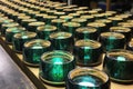 rows of glass lenses in various stages of production