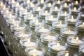 rows of gleaming clear jars waiting for scented candles