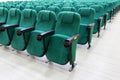 rows of green chairs in the auditorium of a cinema or theater. Royalty Free Stock Photo