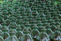 Rows of green plastic bottles