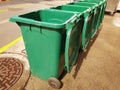 Rows of green plastic recycling bin. Royalty Free Stock Photo