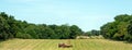 The farmer gets summer hay work done. Royalty Free Stock Photo