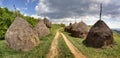 Rows of haystacks in Banat, Romania Royalty Free Stock Photo