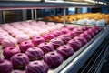 rows of jelly-filled donuts cooling in a professional bakery