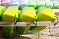 Rows of kayaks on wooden storage racks