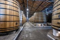 Rows of large oak barrels of port wine inside the cellar of the Real Companhia Velha company, Porto, Portugal Royalty Free Stock Photo