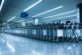 Rows of luggage baskets in the airport terminal. Empty airport