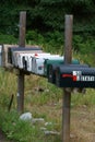 Rows of Mail Boxes sits becide a Mountian Pass Road Royalty Free Stock Photo