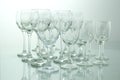 Rows of many empty wine glasses on a table Royalty Free Stock Photo