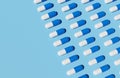 Rows Of Medicine Capsules On A Blue Background