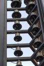Rows of metal bells hanging from a building Royalty Free Stock Photo