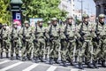 Rows of military troop marching on streets during sunny summer day Royalty Free Stock Photo