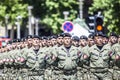 Rows of military troop marching on streets during sunny summer day Royalty Free Stock Photo