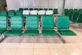 Rows of modern green chairs in waiting room Royalty Free Stock Photo