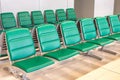 Rows of modern green chairs in waiting room Royalty Free Stock Photo