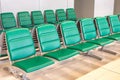 Rows of modern green chairs in waiting room