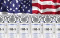 Rows of multiple Covid-19 vaccine ampules with USA flag in background. Mass production and inoculation concept.