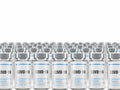 Rows of multiple Covid-19 vaccine vials isolated on a white background. Royalty Free Stock Photo