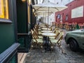Rows of neatly arranged cafe tables and umbrellas waiting for diners, Paris, France
