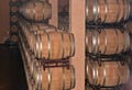 Rows of oak barrel of red wine in cellar of winery in Spain