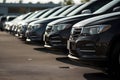 Rows of new cars parked in a dealership parking lot for sales, automotive industry