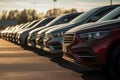 Rows of new cars parked in a dealership parking lot for sales, automotive industry