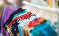 Rows of colorful clothes on hangers at shop. Royalty Free Stock Photo