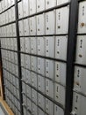 Rows of numbered metal post office mailboxes Royalty Free Stock Photo