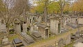 Rows of old grave monuments in in Mont martre cemetery, Paris, France,
