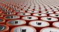 Rows of Orange Cylindrical Batteries in a Repeating Pattern silver metal Royalty Free Stock Photo