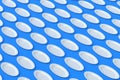 Rows of oval plates on blue background