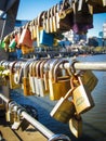 Rows of padlocks attached to the rails of Southbank footbridge