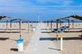 Rows of the palm leaf sun shades on the beach Royalty Free Stock Photo