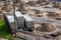 Rows of pits at a construction site. preparation of the site for the installation of piles. a pile of sand