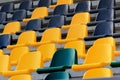 Rows of plastic black and yellow seats at a stadium Royalty Free Stock Photo