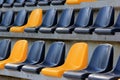 Rows of plastic black and yellow seats at a stadium Royalty Free Stock Photo