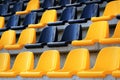 Rows of plastic black and yellow seats at a stadium Royalty Free Stock Photo