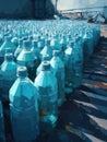 Rows of plastic water bottles abandoned in the sun drying up and becoming brittle.. AI generation