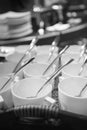 Rows of pure white cup and saucer with teaspoon Royalty Free Stock Photo