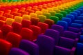 Rows of rainbow color seats in a theater. Generative AI