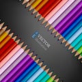 Rows of rainbow colored pencils on dark grey background.