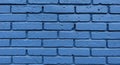 Rows of rectangular bricks painted blue, with visible texture and irregularities on the Royalty Free Stock Photo
