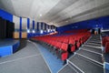 Rows of red, blue seats in Neva cinema