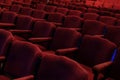 rows of red chairs at a theater or movie cinema