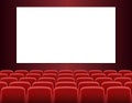 Rows of red cinema or theater seats with blank screen Royalty Free Stock Photo